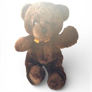 Vintage Dakin dark brown teddy bear plush stuffed animal toy with orange bow